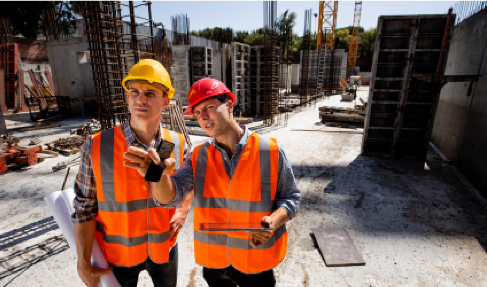 Image of a two man onlooking something on a construction site